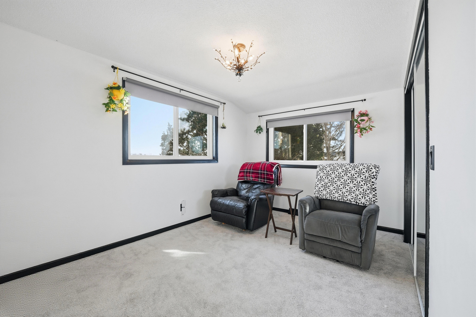 9807 North Leaf River Road Leaf River, IL 61047 - Photo 22 of 38 a living room with furniture and a chandelier