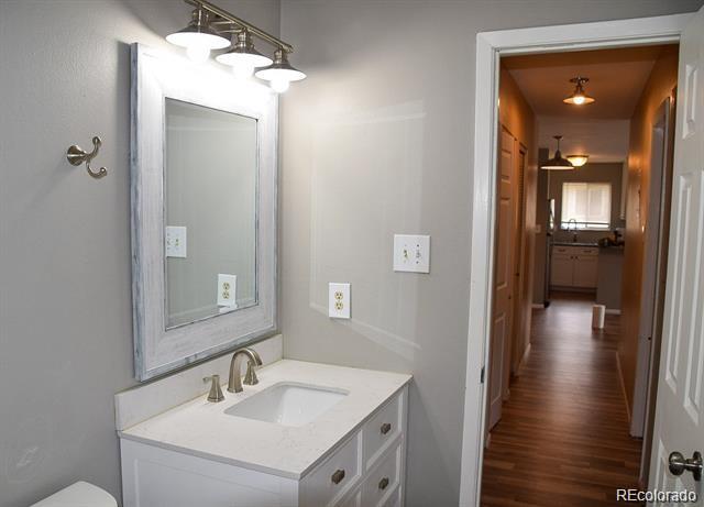 1225 South Oneida Street, Unit 252 Denver, CO 80224 - Photo 10 of 20 a en suite bathroom with a sink and a mirror