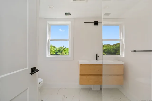 a bathroom with a tub and a window