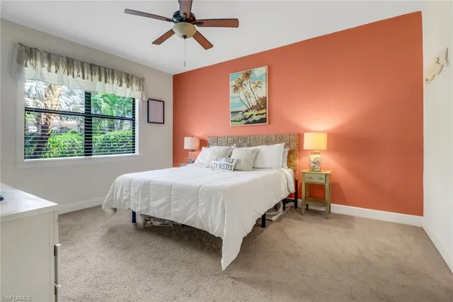 a view of a livingroom with a window and a flat screen tv