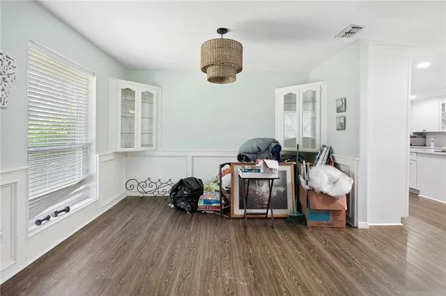 a bedroom with furniture and a window