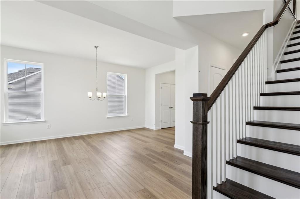 116 Fox Water Trail Beaver, PA 15009 - Photo 11 of 45 a view of an empty room with wooden floor and stairs
