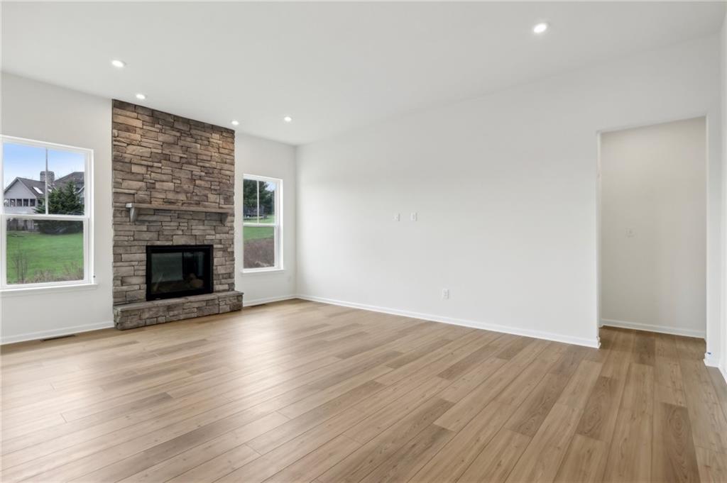 116 Fox Water Trail Beaver, PA 15009 - Photo 13 of 45 an empty room with wooden floor and fireplace