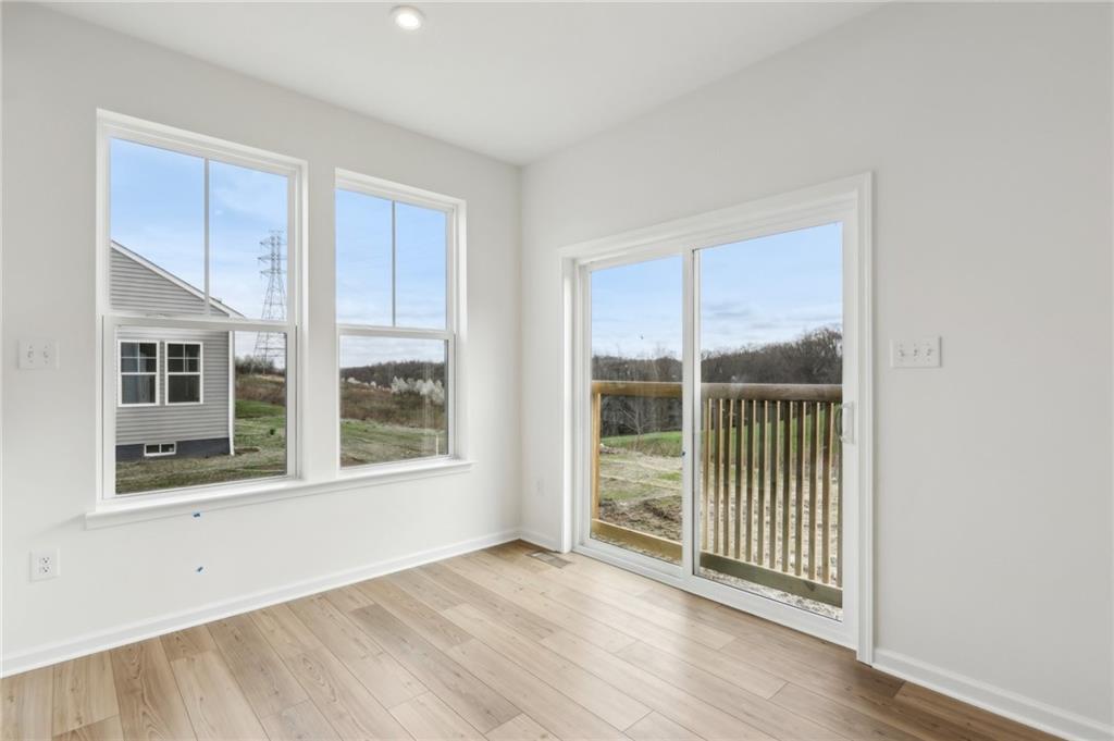 116 Fox Water Trail Beaver, PA 15009 - Photo 17 of 45 an empty room with wooden floor and windows
