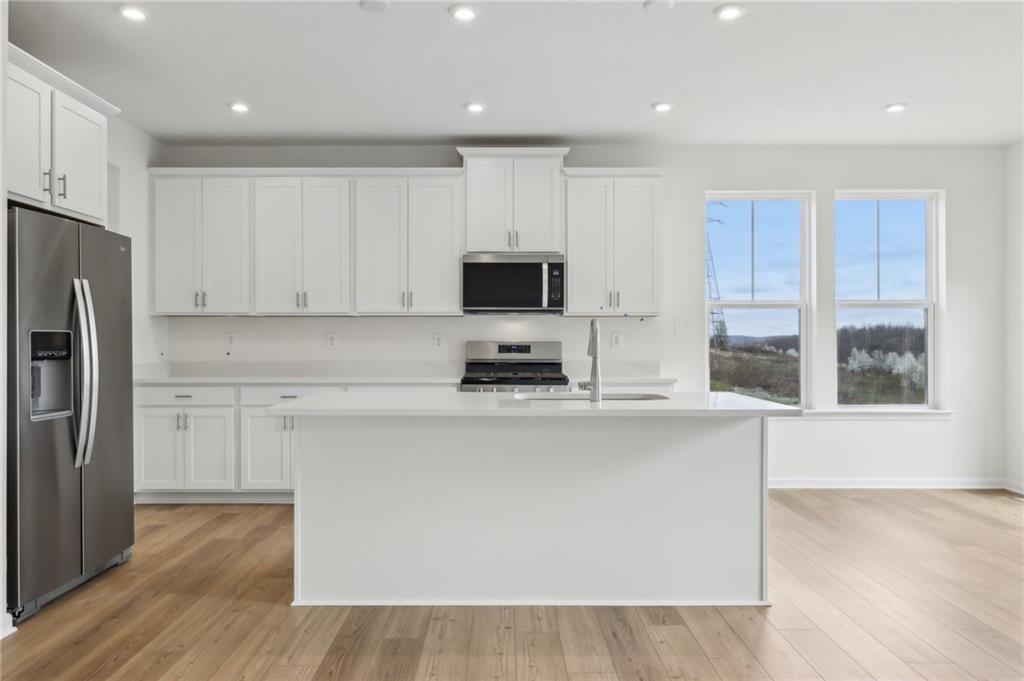 116 Fox Water Trail Beaver, PA 15009 - Photo 18 of 45 a kitchen with a refrigerator and a stove top oven