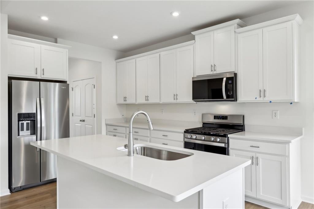 116 Fox Water Trail Beaver, PA 15009 - Photo 19 of 45 a kitchen with stainless steel appliances a sink a stove a microwave and cabinets