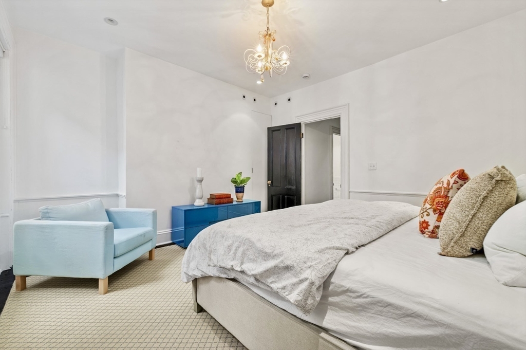 22 Joy Street Boston, MA 02114 - Photo 18 of 36 a bedroom with bed and a couch