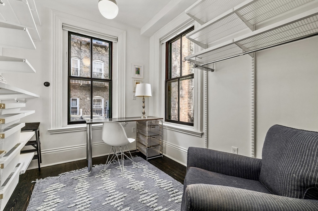 22 Joy Street Boston, MA 02114 - Photo 19 of 36 a living room with furniture and a window