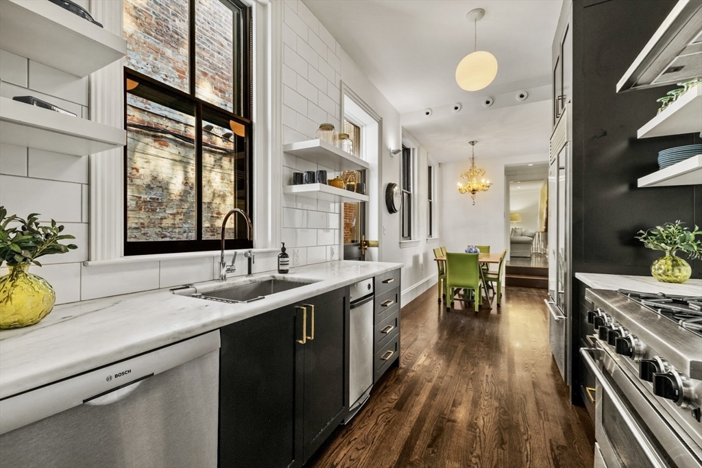 22 Joy Street Boston, MA 02114 - Photo 4 of 36 a kitchen with a sink appliances and wooden floor