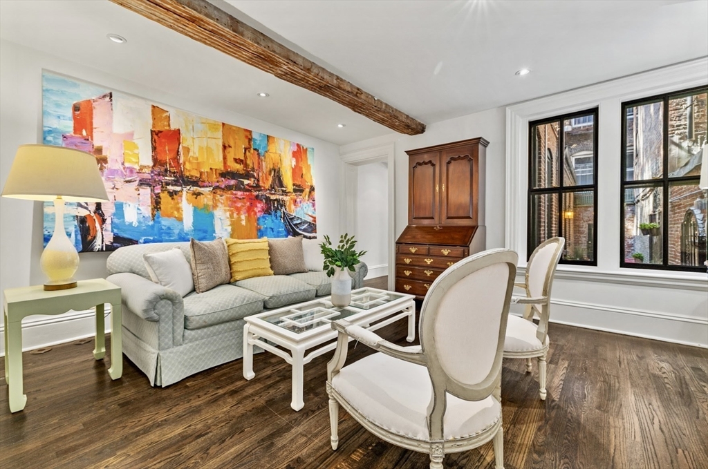 22 Joy Street Boston, MA 02114 - Photo 8 of 36 a living room with furniture fireplace and a large window