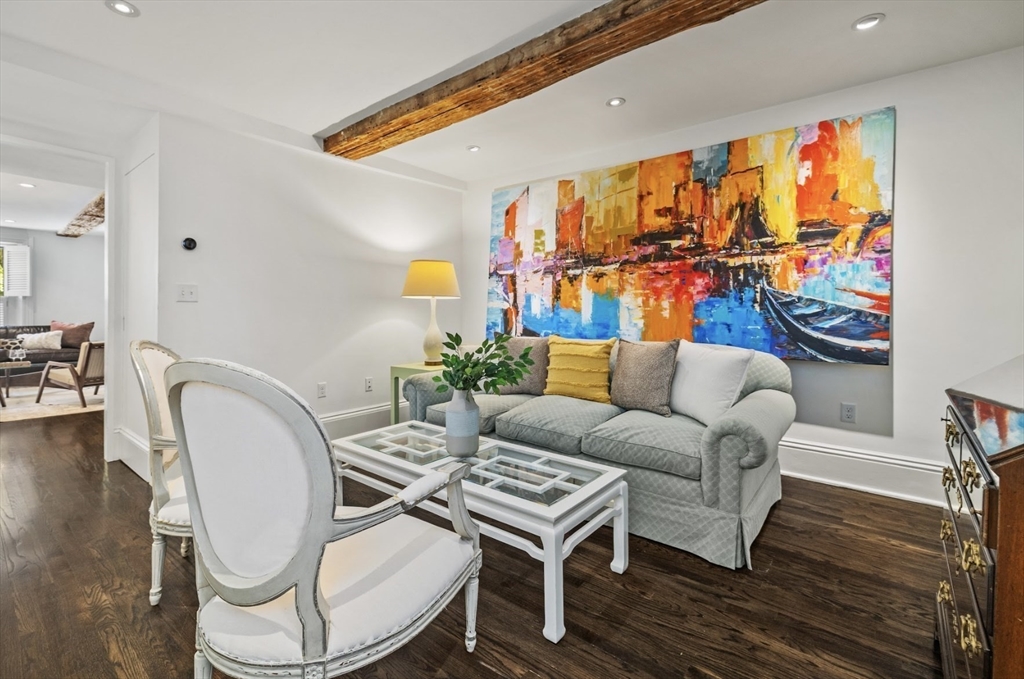 22 Joy Street Boston, MA 02114 - Photo 9 of 36 a living room with furniture a rug and a wall painting