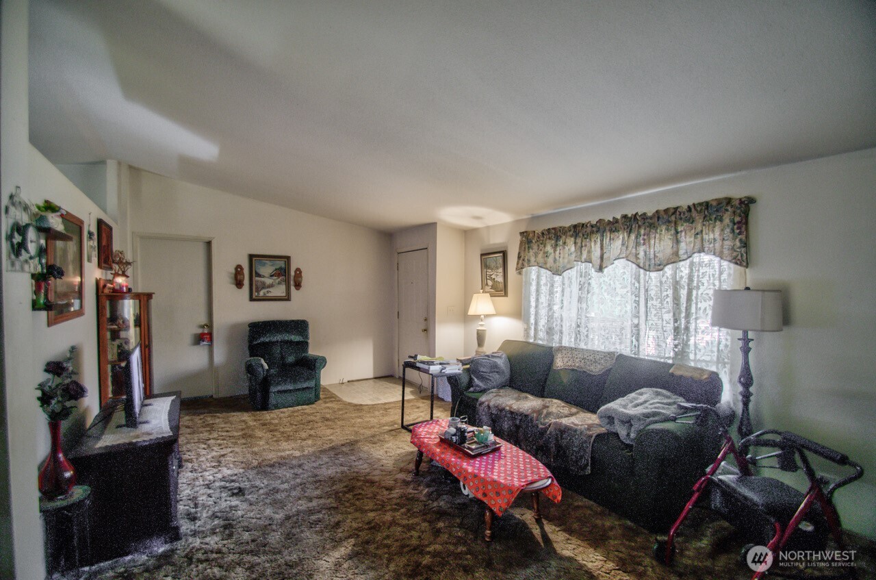 236 Tryon Road Onalaska, WA 98570 - Photo 18 of 40 a living room with furniture and a flat screen tv
