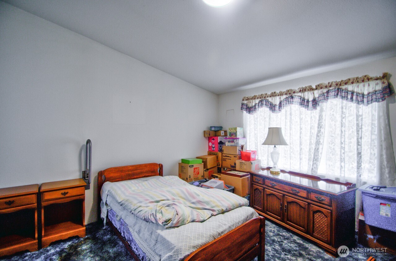 236 Tryon Road Onalaska, WA 98570 - Photo 2 of 40 a bed room with a bed and a window