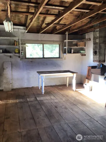 a view of a storage room with wooden floor