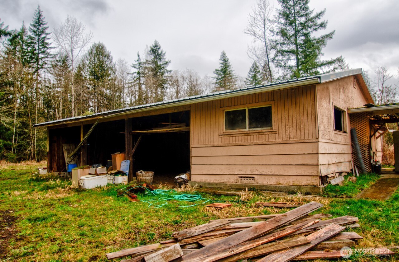236 Tryon Road Onalaska, WA 98570 - Photo 38 of 40 a view of a backyard with large trees and plants