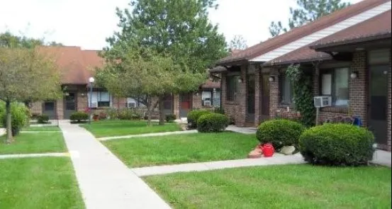 a view of a house with a yard and plants