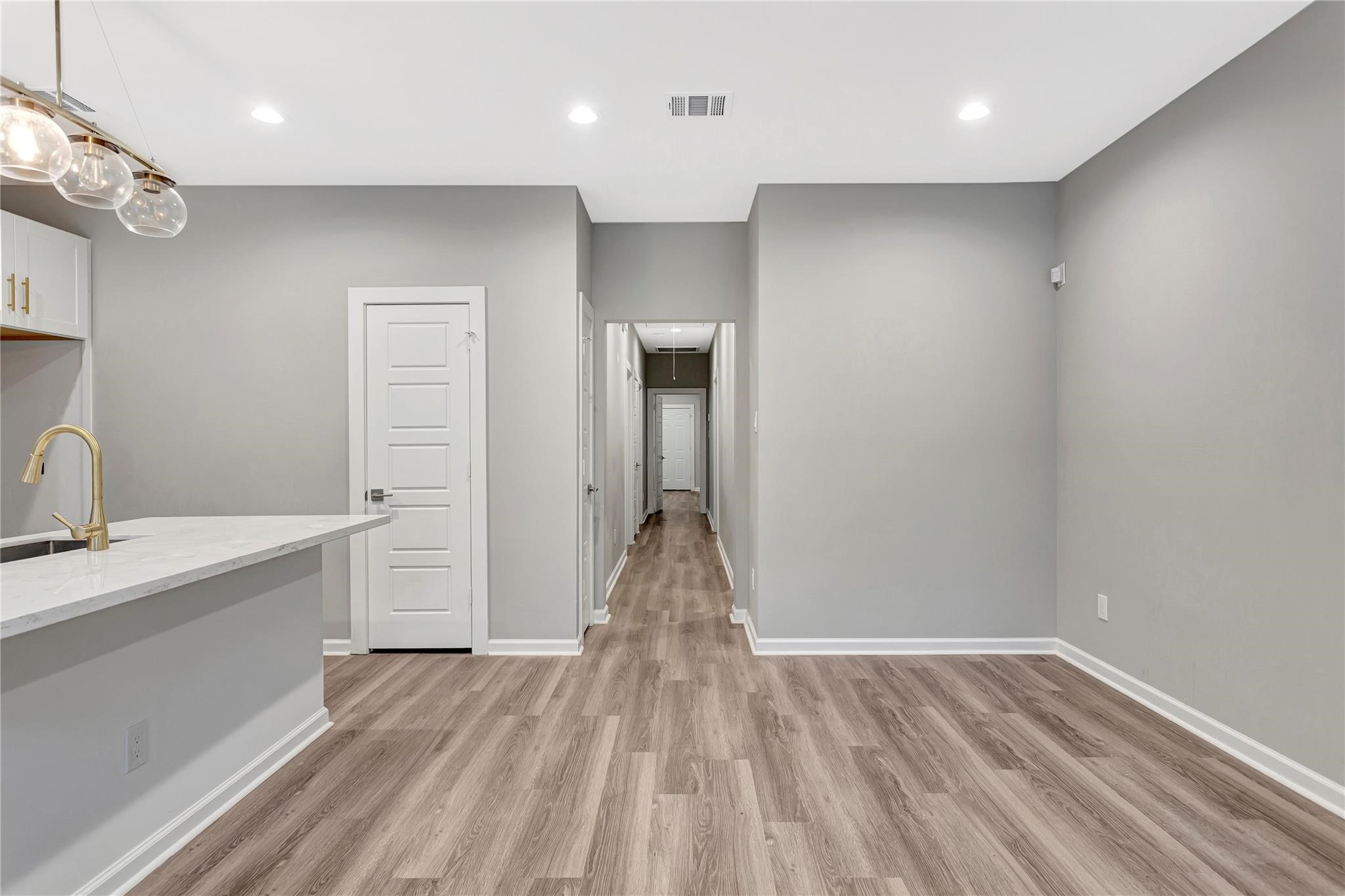 6813 Liverpool Street, Unit B Houston, TX 77021 - Photo 2 of 9 Open, bright space with recessed lighting and LVP flooring flowing seamlessly into the kitchen