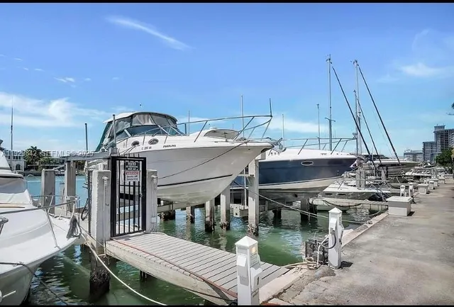 a bathroom with a tub a sink and mirror