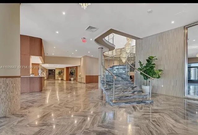 a view of a big room with closet and windows