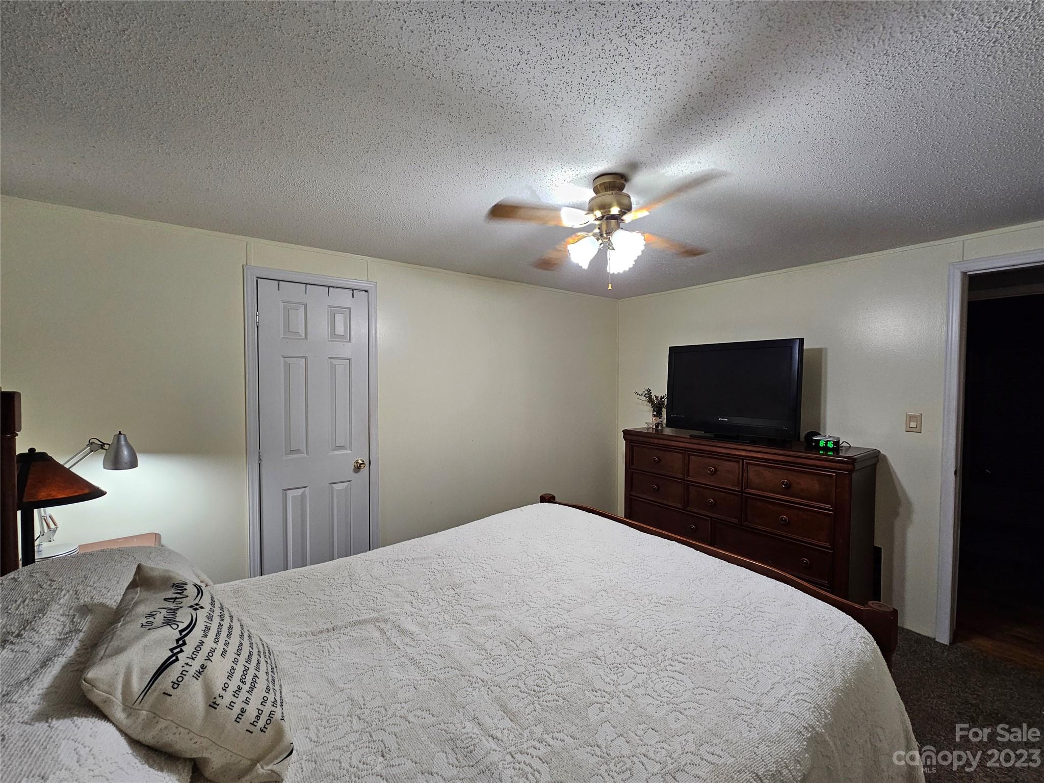 290 Long Street Rutherfordton, NC 28139 - Photo 18 of 23 a bedroom with a bed and a flat screen tv