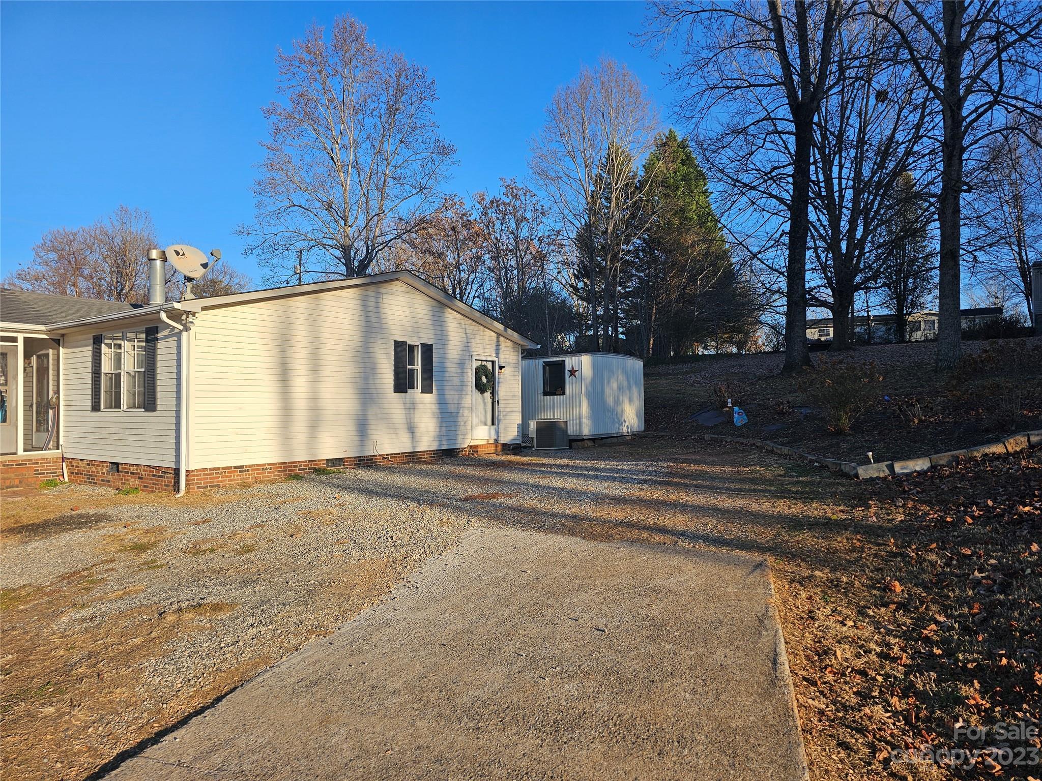290 Long Street Rutherfordton, NC 28139 - Photo 3 of 23 a view of white house with a yard