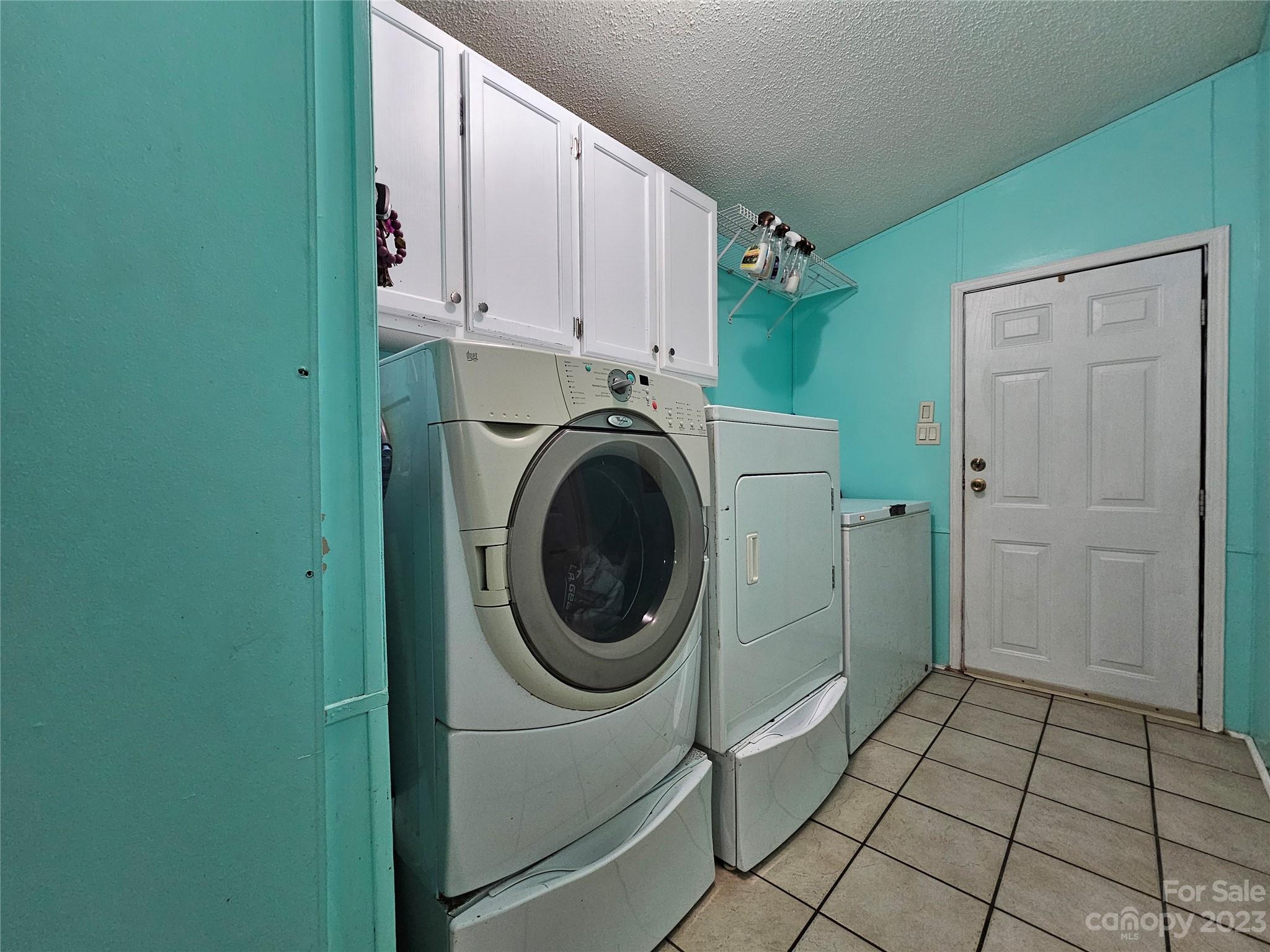 290 Long Street Rutherfordton, NC 28139 - Photo 5 of 23 a view of a hallway with washer and dryer