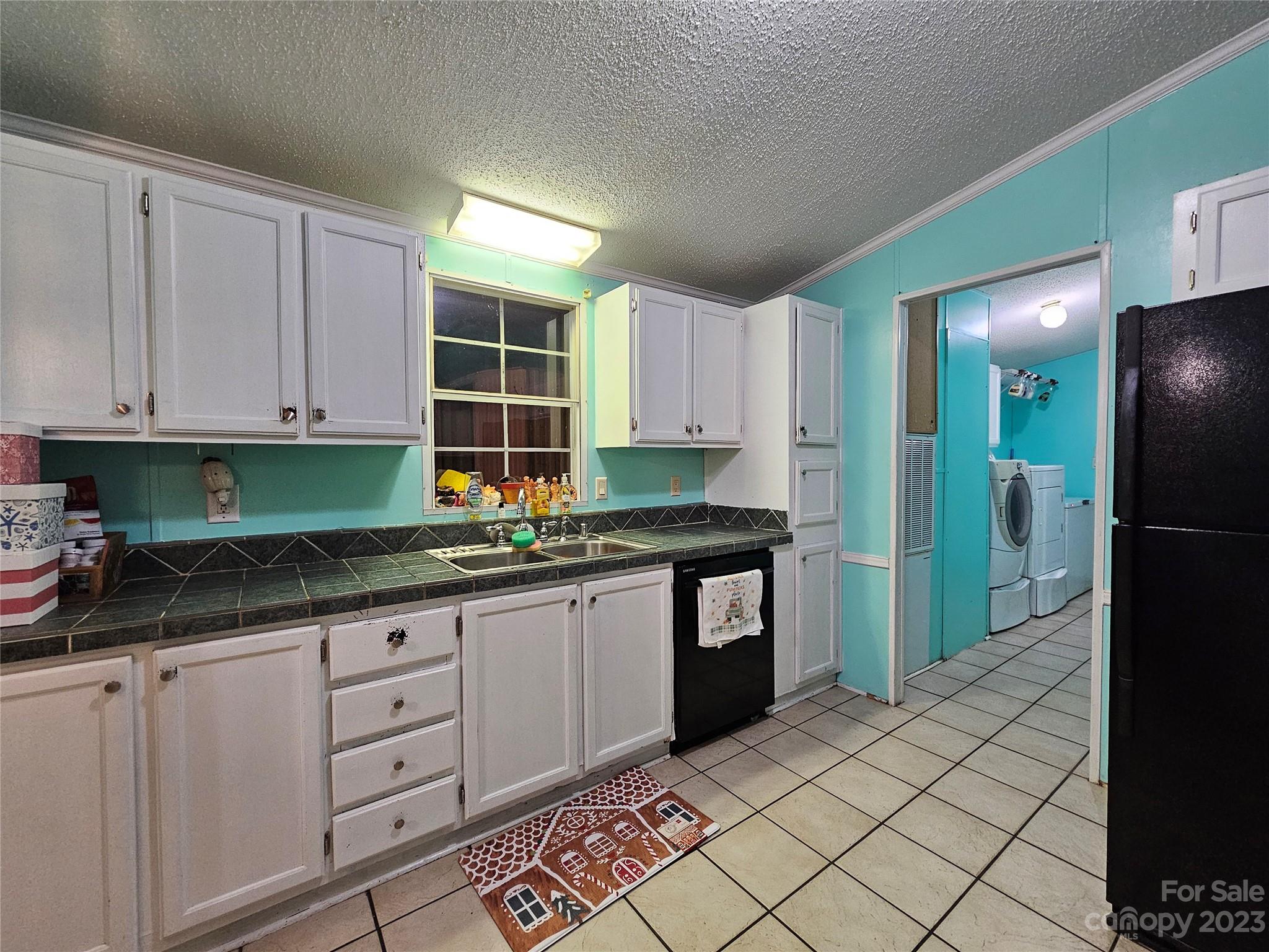 290 Long Street Rutherfordton, NC 28139 - Photo 6 of 23 a kitchen with granite countertop a sink and a stove top oven