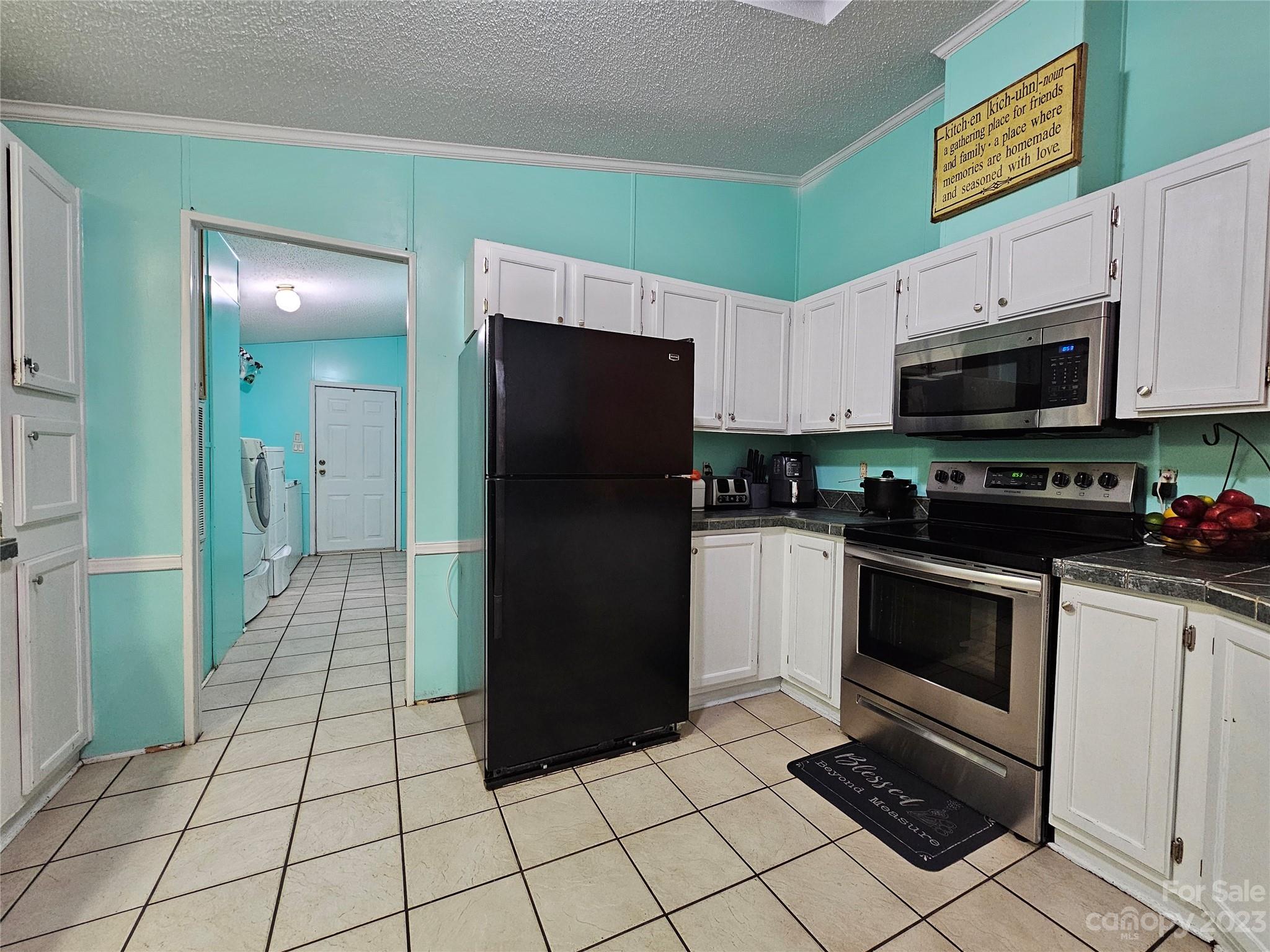290 Long Street Rutherfordton, NC 28139 - Photo 7 of 23 a kitchen with stainless steel appliances granite countertop a refrigerator and a stove top oven