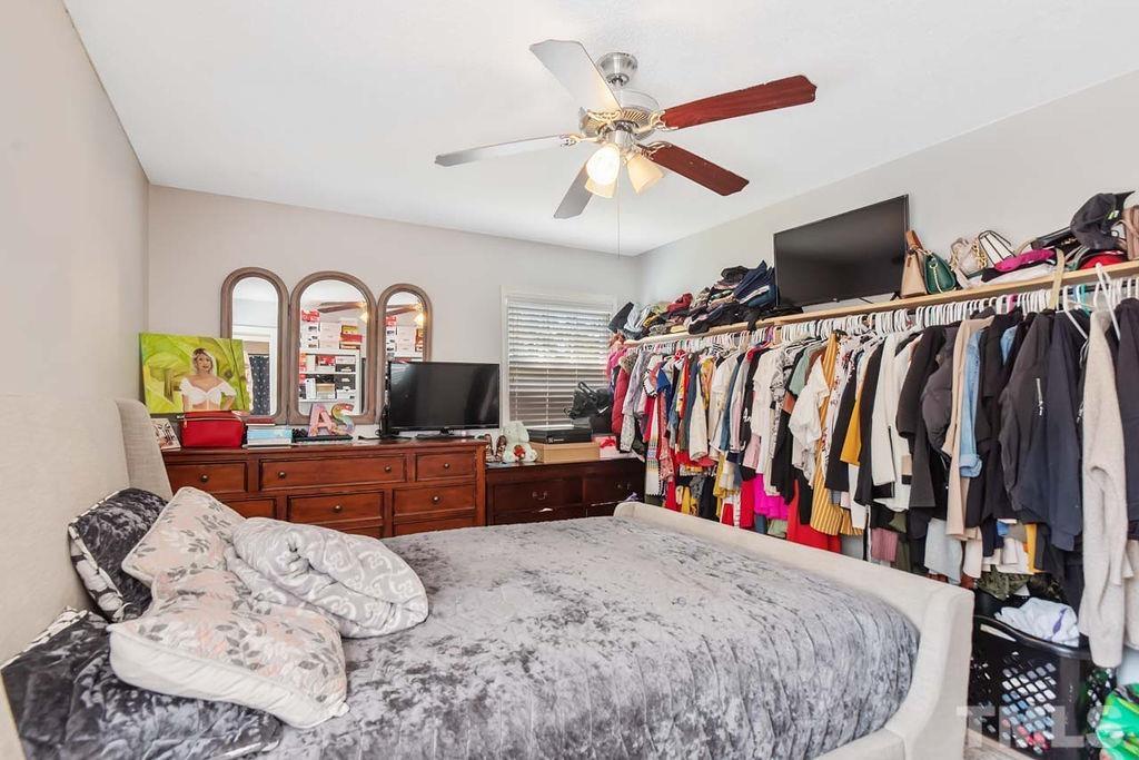 7500 Idolbrook Lane Raleigh, NC 27615 - Photo 17 of 28 a bed room with a bed and a television