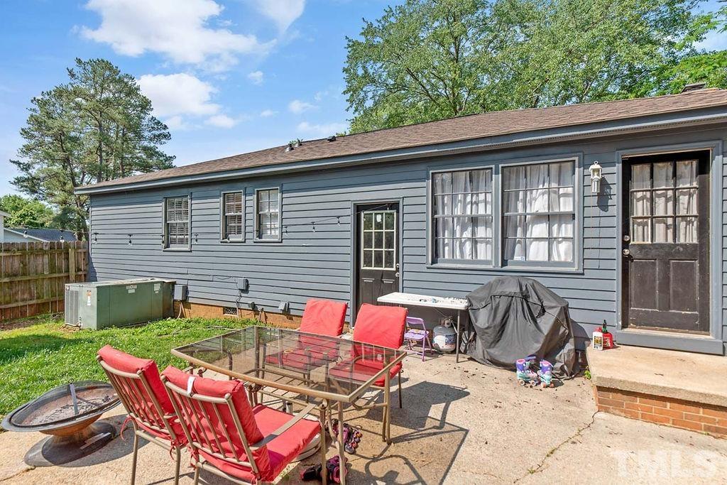 7500 Idolbrook Lane Raleigh, NC 27615 - Photo 6 of 28 a view of backyard with outdoor seating a patio and plants