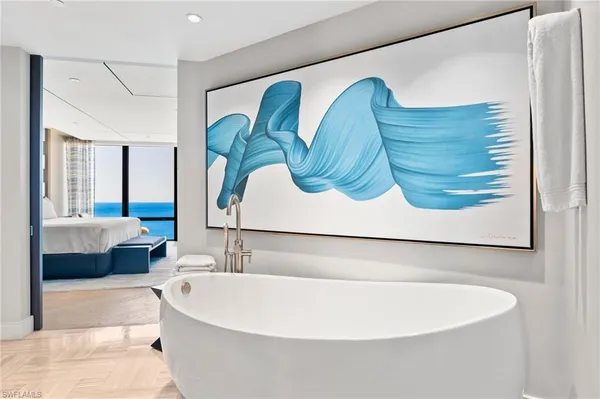 a white bath tub sitting in a bathroom