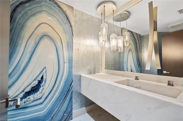 a spacious bathroom with a bathtub and a large mirror