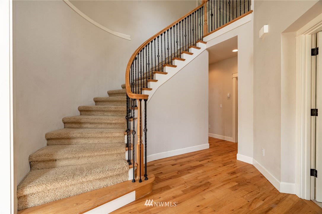 16228 Three Lakes Road Snohomish, WA 98290 - Photo 3 of 23 a view of entryway and hall with wooden floor