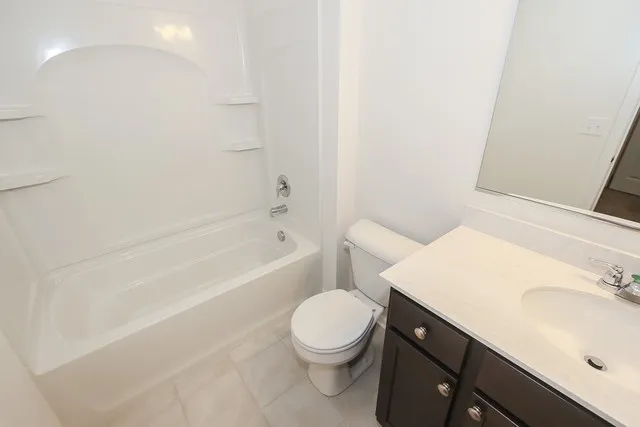 a bathroom with a sink a toilet and bathtub