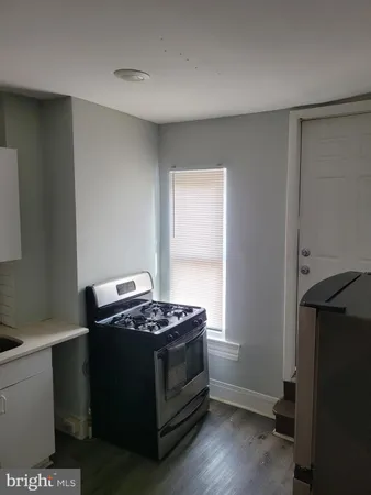 a kitchen with a stove and a microwave