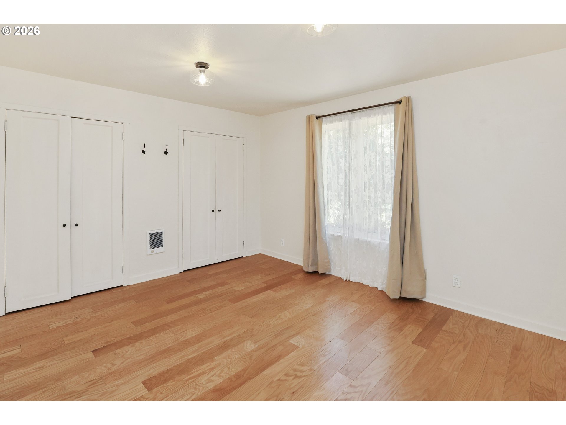 24496 McCain Road Monroe, OR 97456 - Photo 13 of 43 a view of an empty room with wooden floor