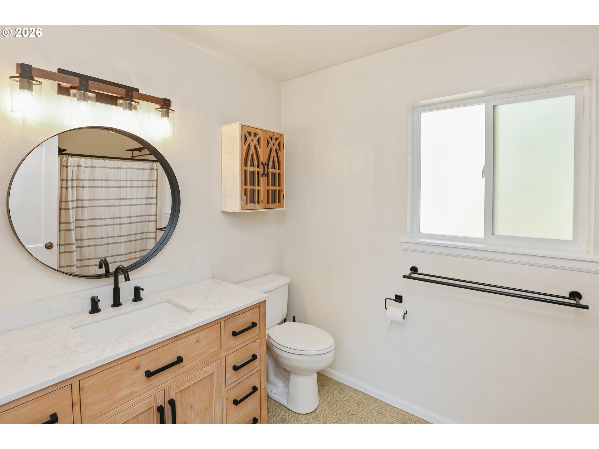 24496 McCain Road Monroe, OR 97456 - Photo 18 of 43 a bathroom with a toilet a sink and mirror