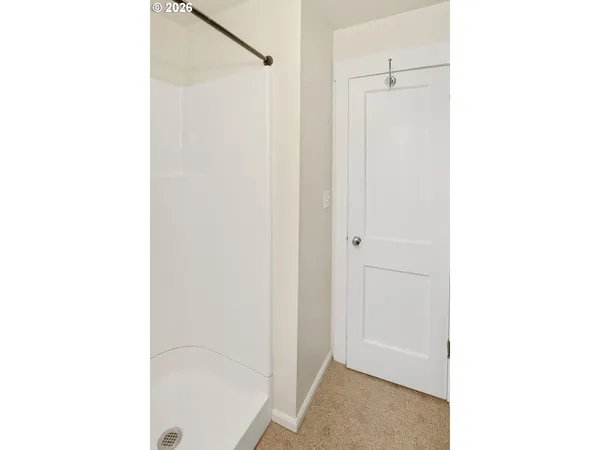 a picture of a bathroom with a shower