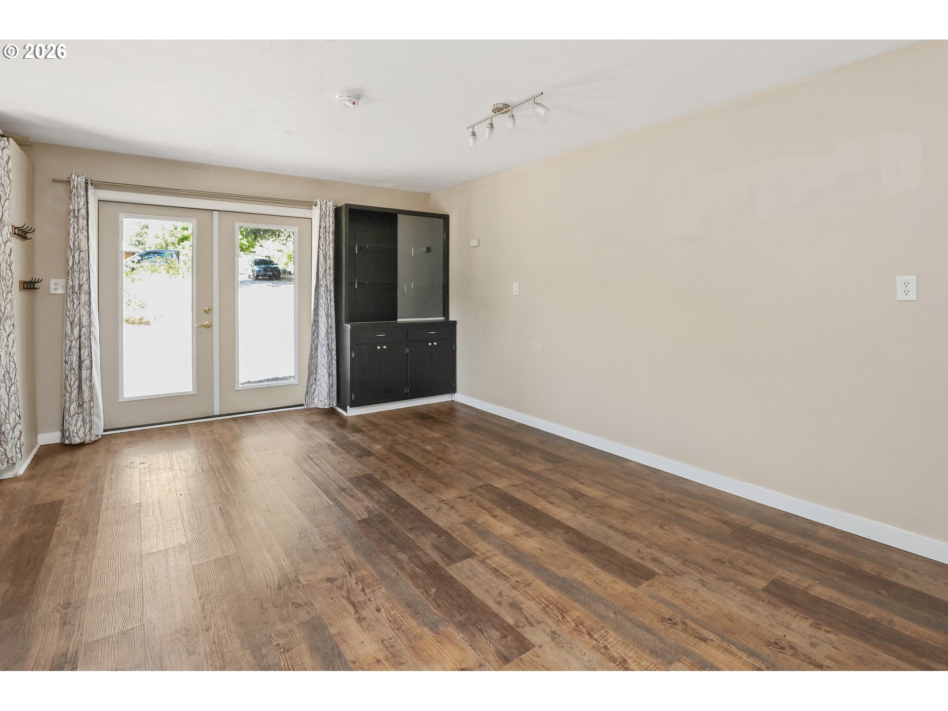 24496 McCain Road Monroe, OR 97456 - Photo 33 of 43 a view of an empty room with wooden floor and a window