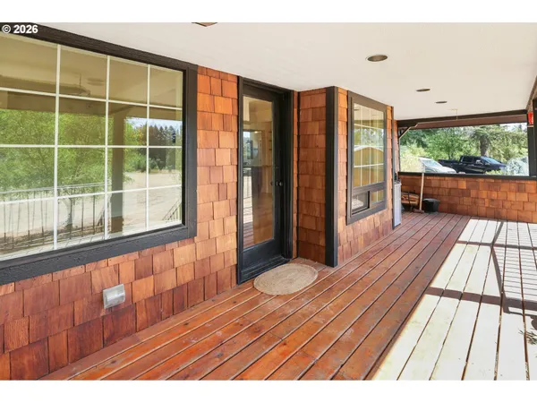 a view of balcony with wooden floor