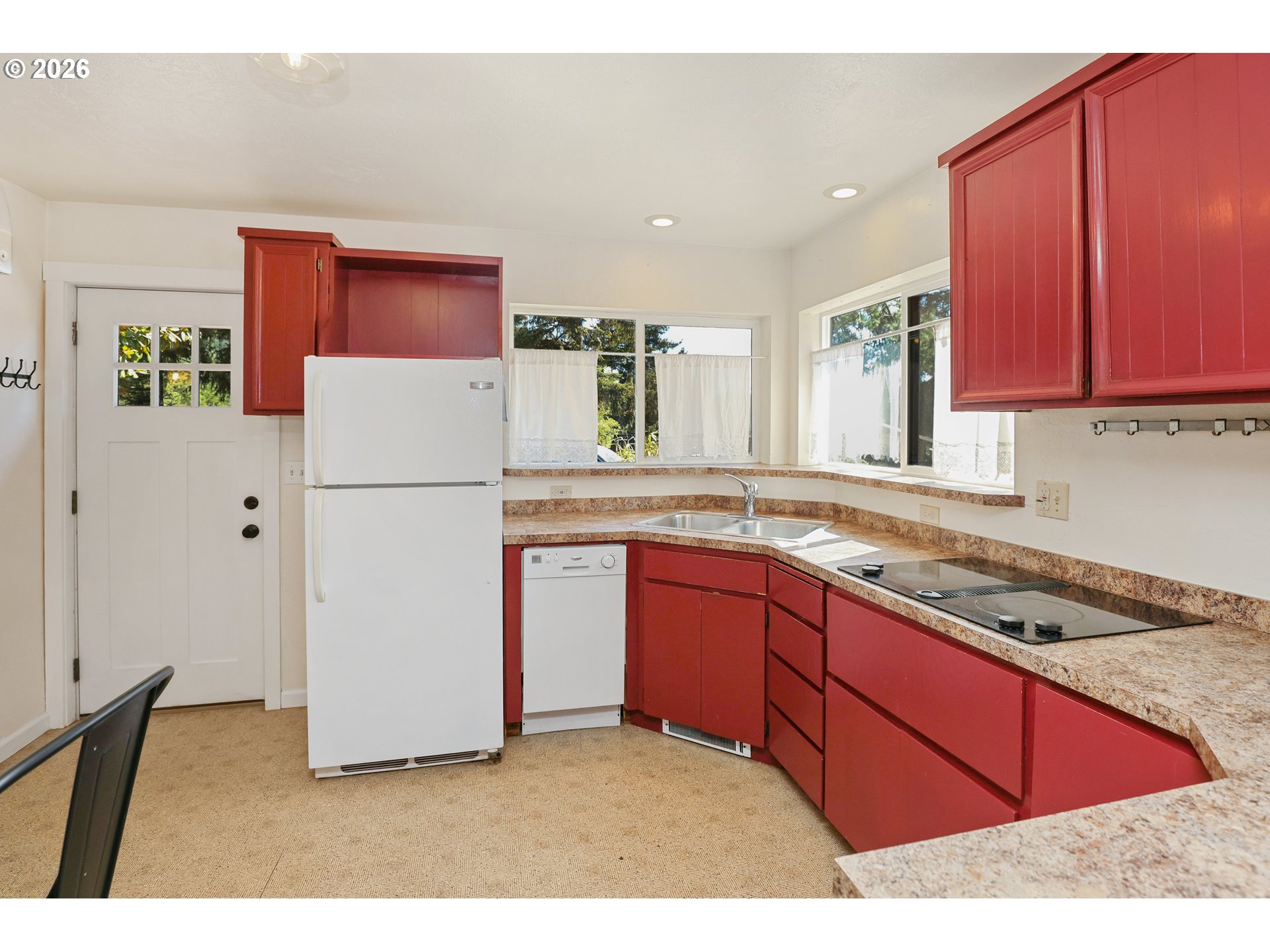 24496 McCain Road Monroe, OR 97456 - Photo 10 of 43 a kitchen with refrigerator cabinets and a counter top space