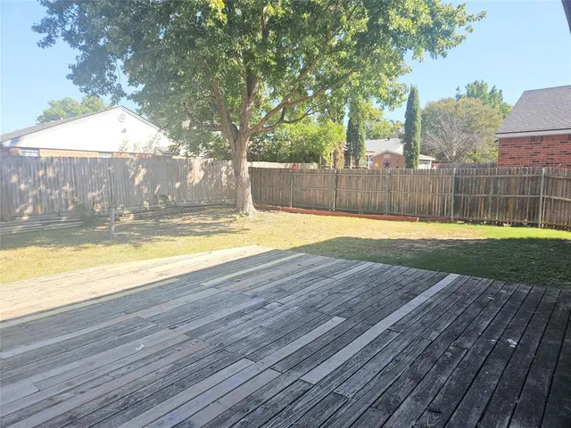 a view of a swimming pool with a yard