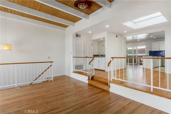 a view of a livingroom with a fireplace and window