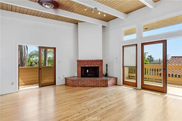 a view of kitchen with cabinets and wooden floor