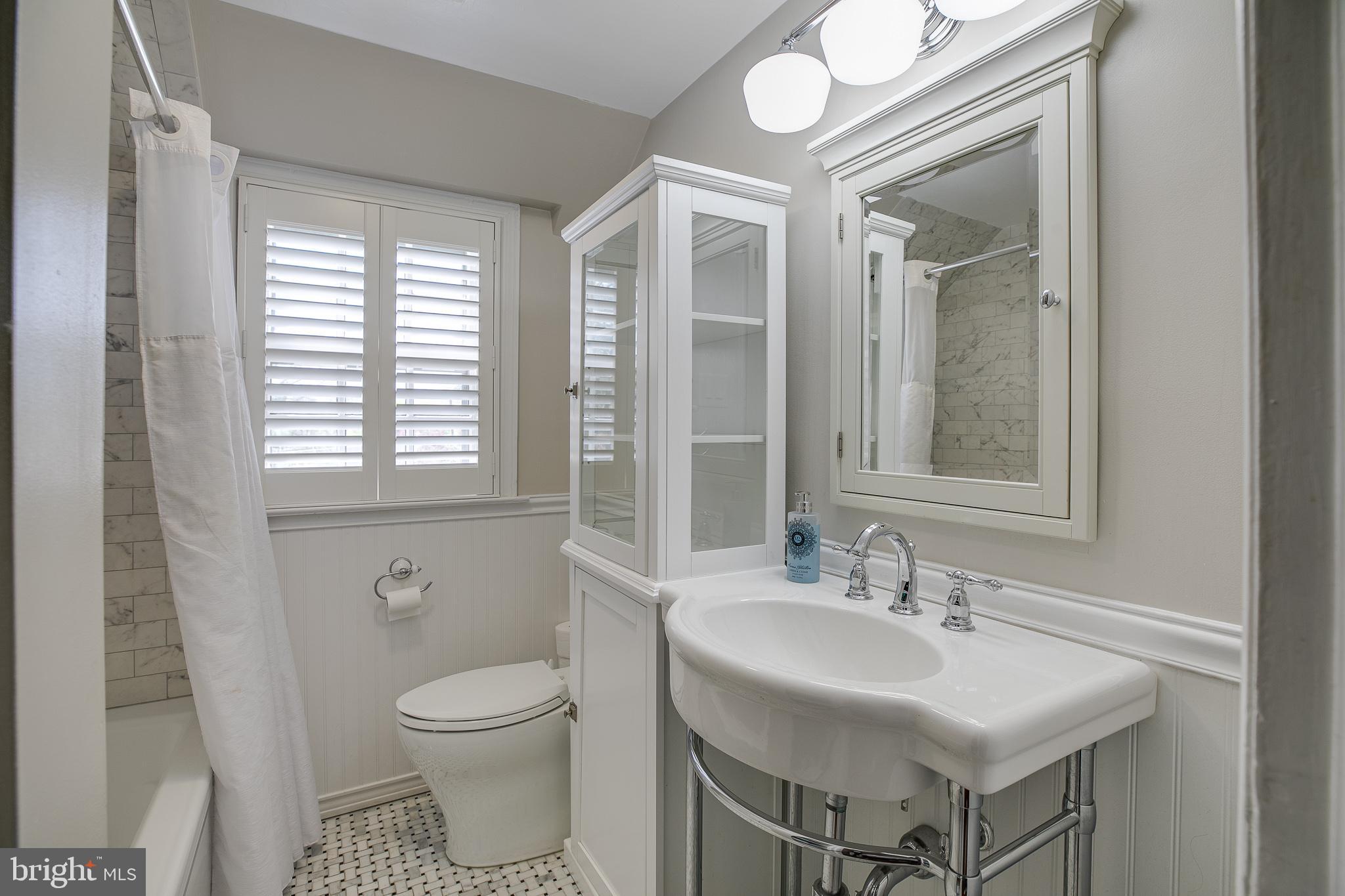 330 Old Lancaster Road Devon, PA 19333 - Photo 26 of 33 a bathroom with a toilet sink and mirror