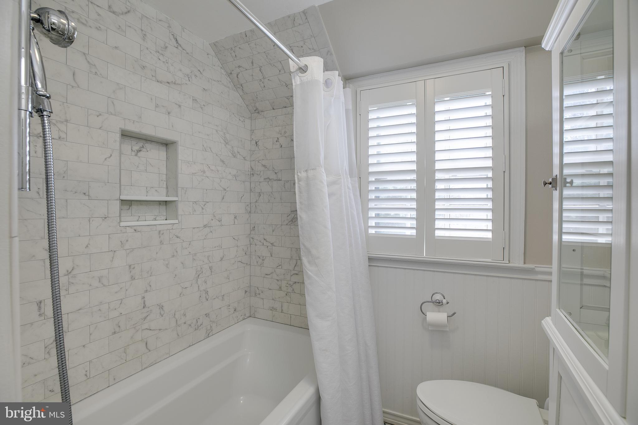 330 Old Lancaster Road Devon, PA 19333 - Photo 27 of 33 a bath room with a toilet and a bath tub
