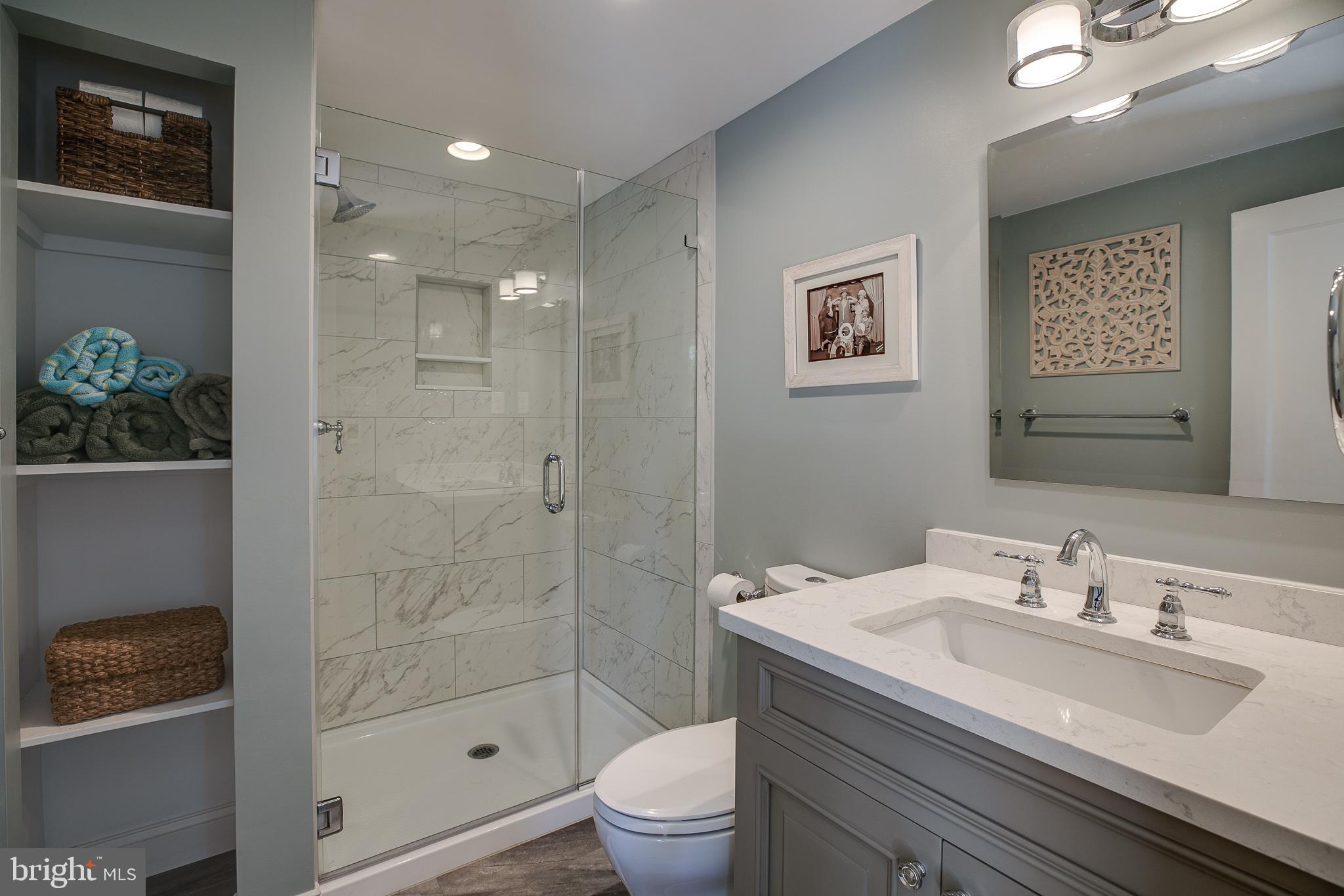 330 Old Lancaster Road Devon, PA 19333 - Photo 31 of 33 a bathroom with a sink a toilet and shower