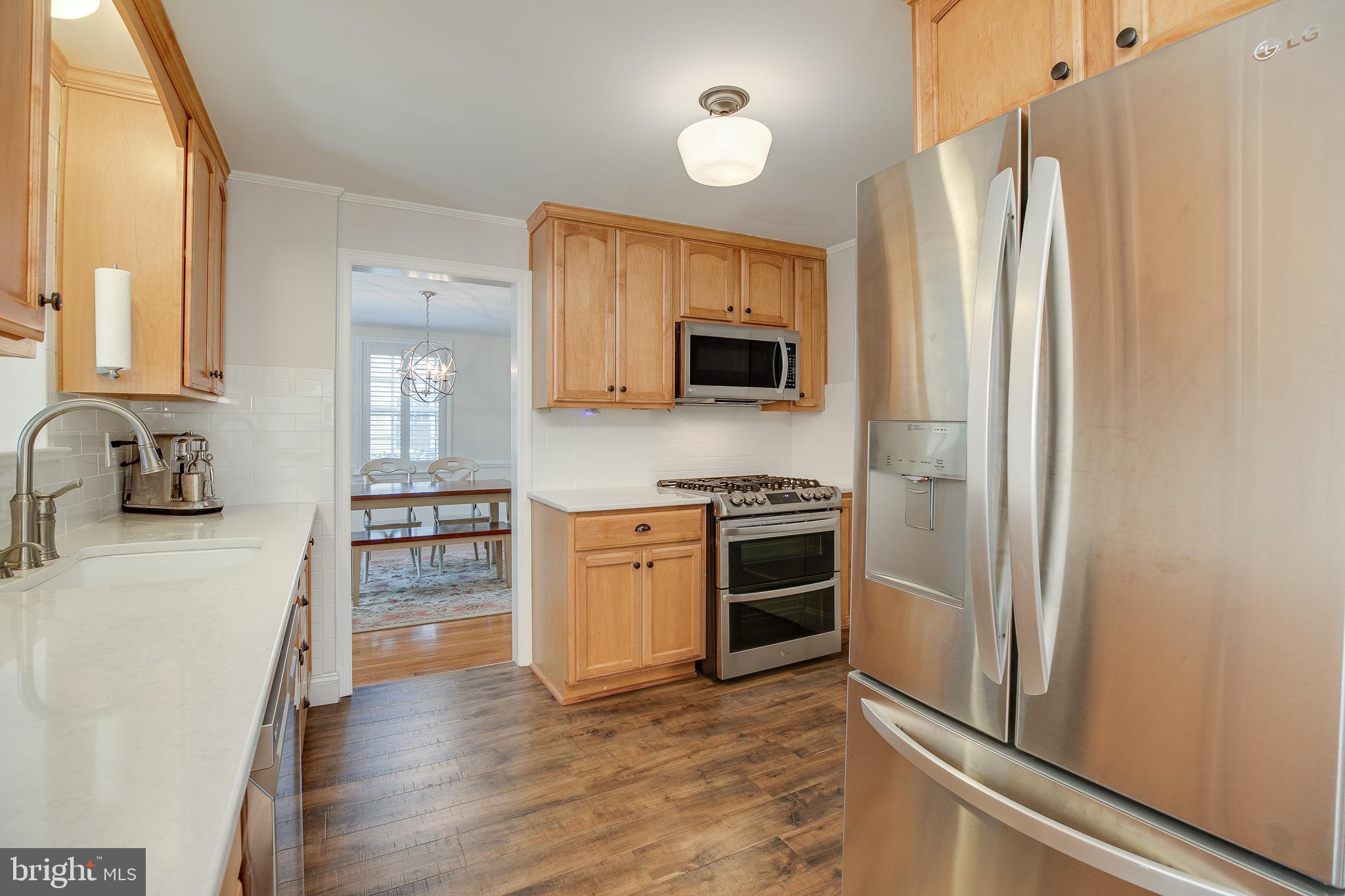 330 Old Lancaster Road Devon, PA 19333 - Photo 9 of 33 a kitchen with stainless steel appliances a refrigerator stove and sink