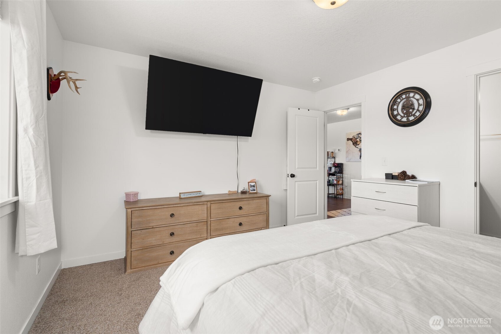 401 Cardinal Avenue Winlock, WA 98596 - Photo 15 of 39 a bedroom with a bed and a flat screen tv
