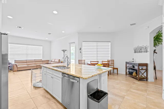 a kitchen with lots of counter top space and appliances